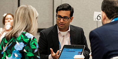 Expert speaking at Gartner conference, offering strategic validation through proprietary research and tools.